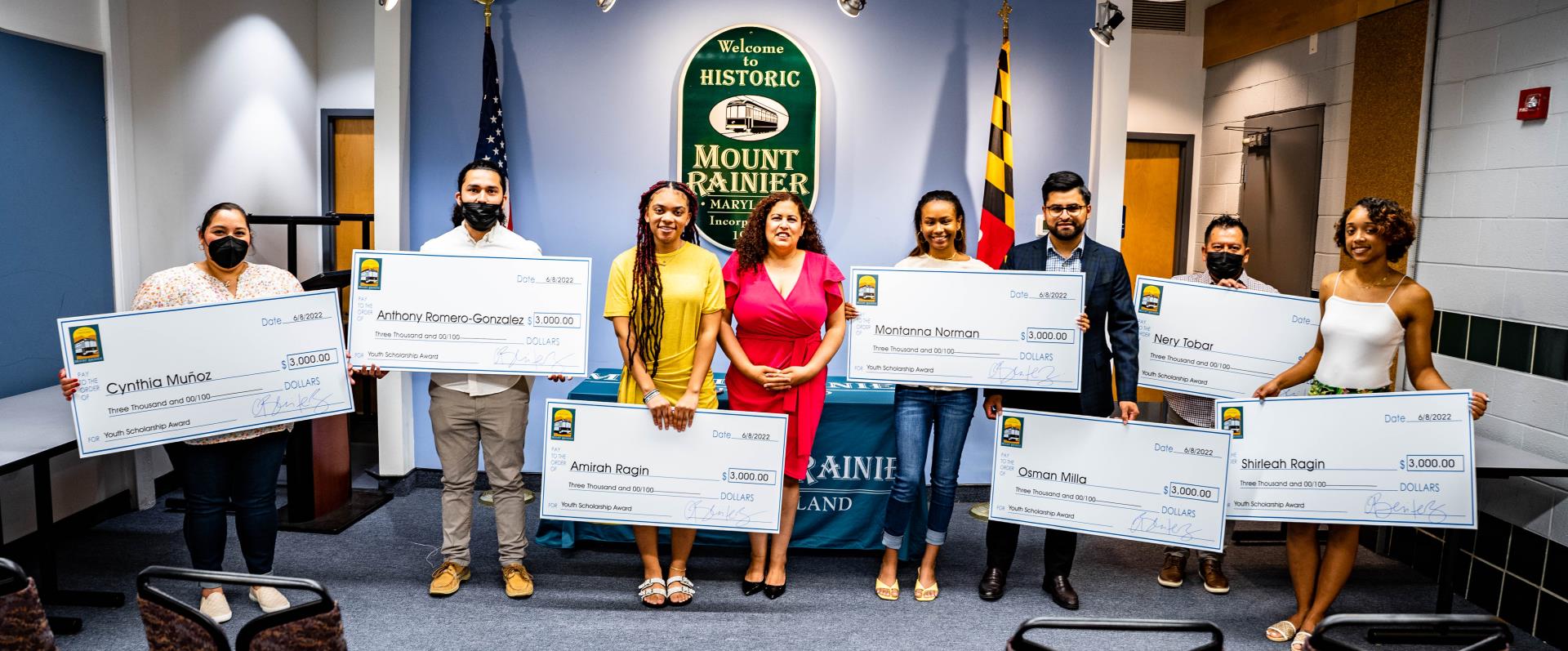 Seven recipients of the Youth Scholarship Award pose with Mayor Celina Benitez.